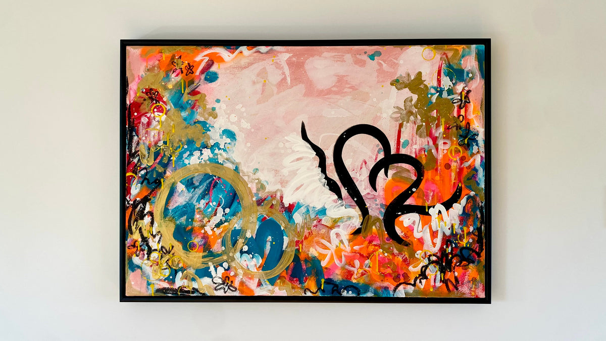 Abstract painting with colorful splashes and black abstract shapes on a white wall.